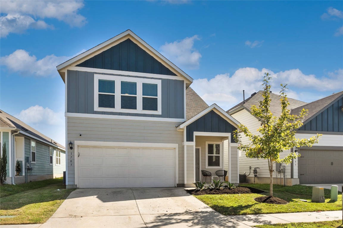 1703 Adobe Walls Way Austin, TX 78725 - Photo 1 of 1 a front view of a house with garden