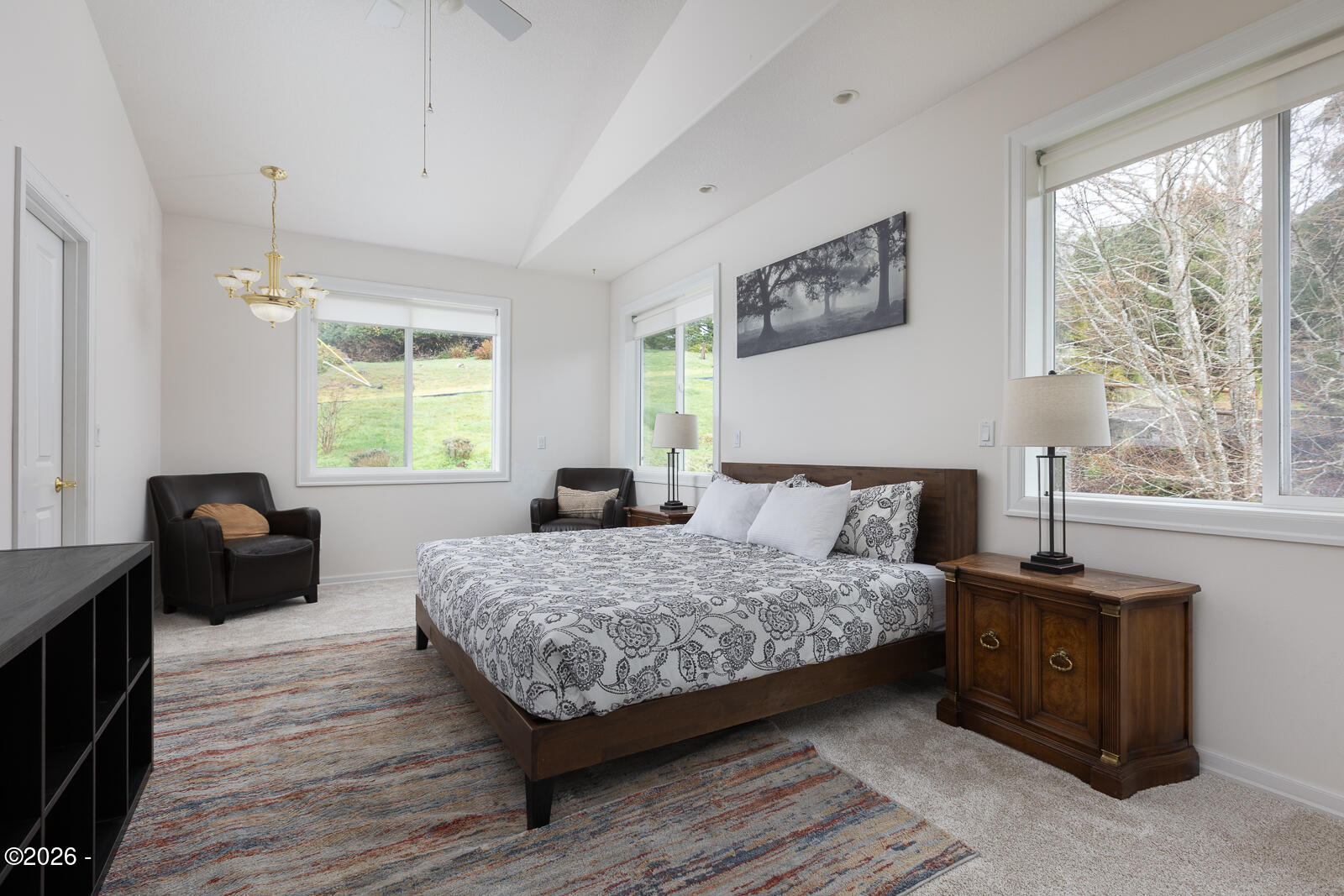 7415 East Summit Road Pacific City, OR 97135 - Photo 15 of 44 a bedroom with a bed and wooden floor