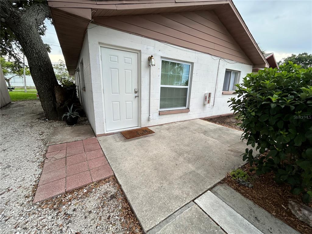 530 5th Avenue West, Unit C Palmetto, FL 34221 - Photo 1 of 27 a view of backyard with large trees and a small yard