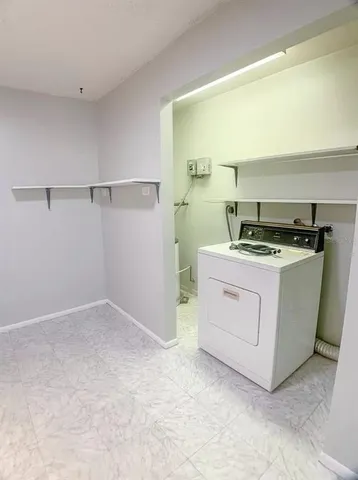 a utility room with washer and dryer