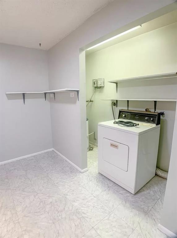 530 5th Avenue West, Unit C Palmetto, FL 34221 - Photo 11 of 27 a utility room with washer and dryer