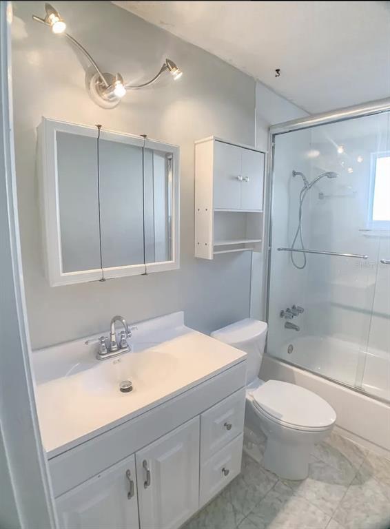 530 5th Avenue West, Unit C Palmetto, FL 34221 - Photo 16 of 27 a bathroom with a sink a toilet and shower