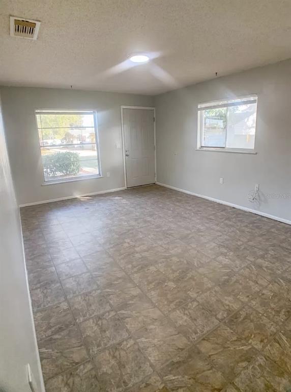 530 5th Avenue West, Unit C Palmetto, FL 34221 - Photo 24 of 27 an empty room with windows
