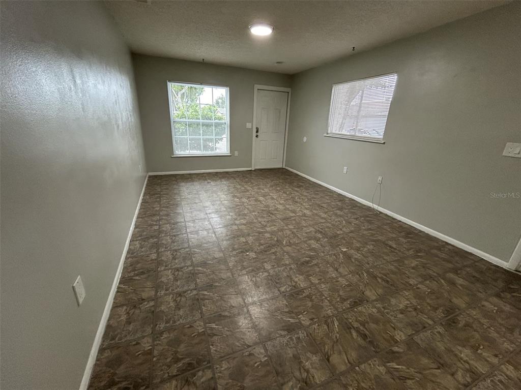 530 5th Avenue West, Unit C Palmetto, FL 34221 - Photo 3 of 27 an empty room with windows