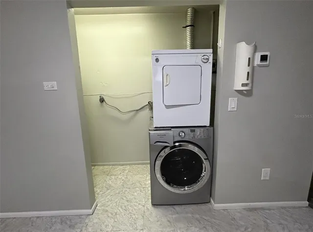 a view of a storage & utility room with a washer and dryer