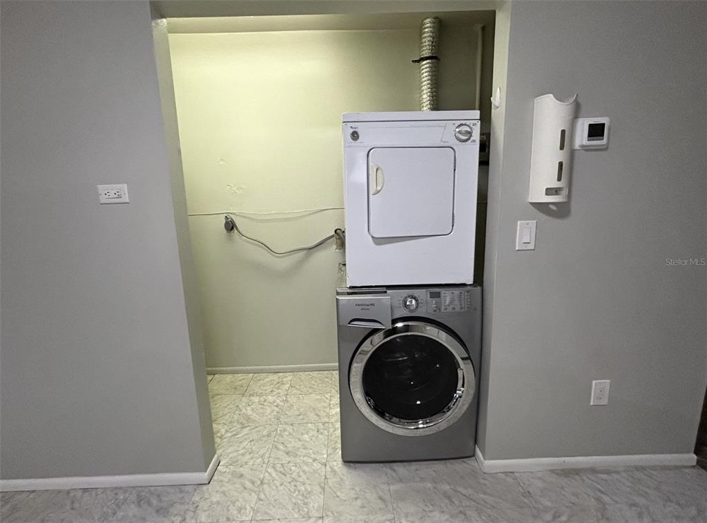 530 5th Avenue West, Unit C Palmetto, FL 34221 - Photo 6 of 27 a view of a storage & utility room with a washer and dryer