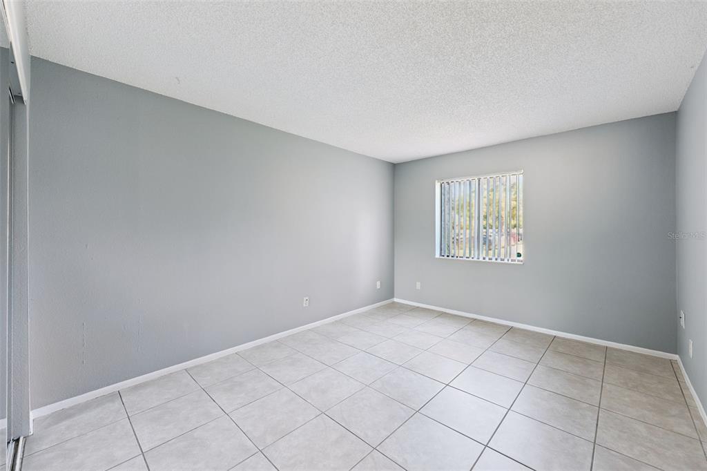 116 Springwood Circle, Unit A Longwood, FL 32750 - Photo 11 of 17 an empty room with windows