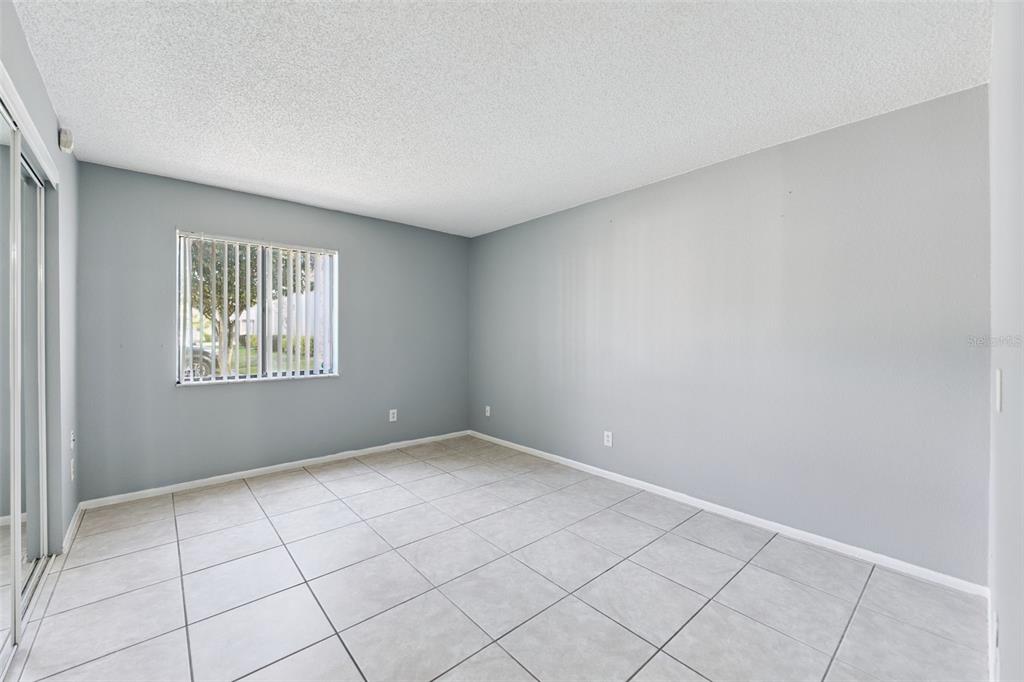 116 Springwood Circle, Unit A Longwood, FL 32750 - Photo 12 of 17 a view of an empty room and window