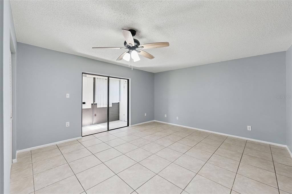 116 Springwood Circle, Unit A Longwood, FL 32750 - Photo 13 of 17 a view of an empty room with a window
