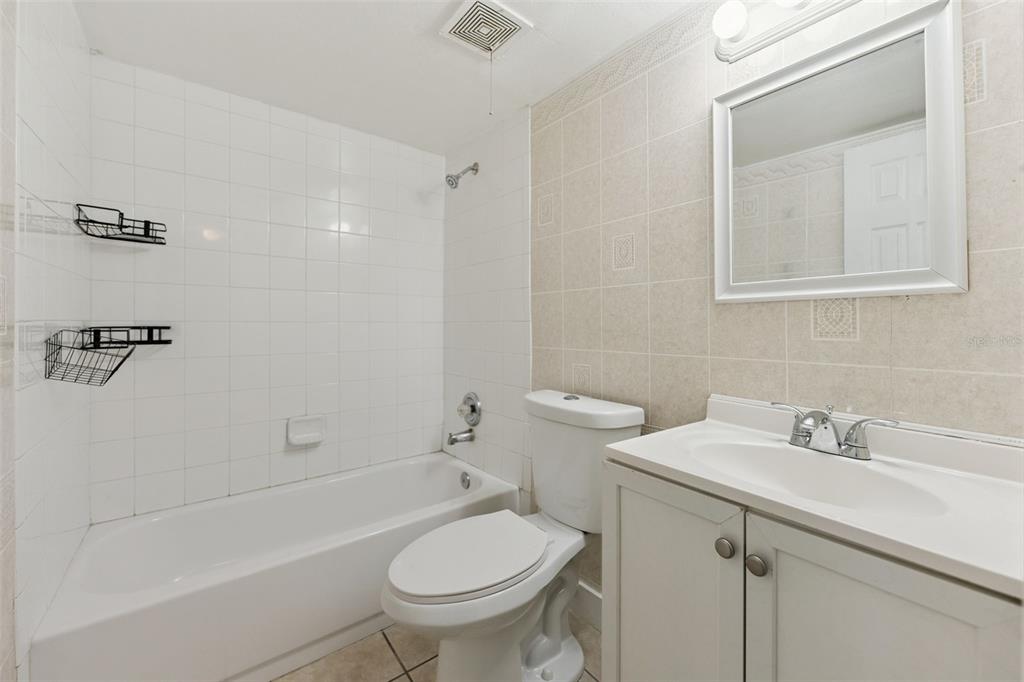 116 Springwood Circle, Unit A Longwood, FL 32750 - Photo 14 of 17 a bathroom with a sink toilet and shower