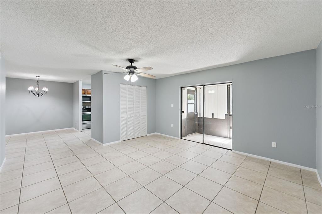 116 Springwood Circle, Unit A Longwood, FL 32750 - Photo 2 of 17 a view of an empty room with glass door