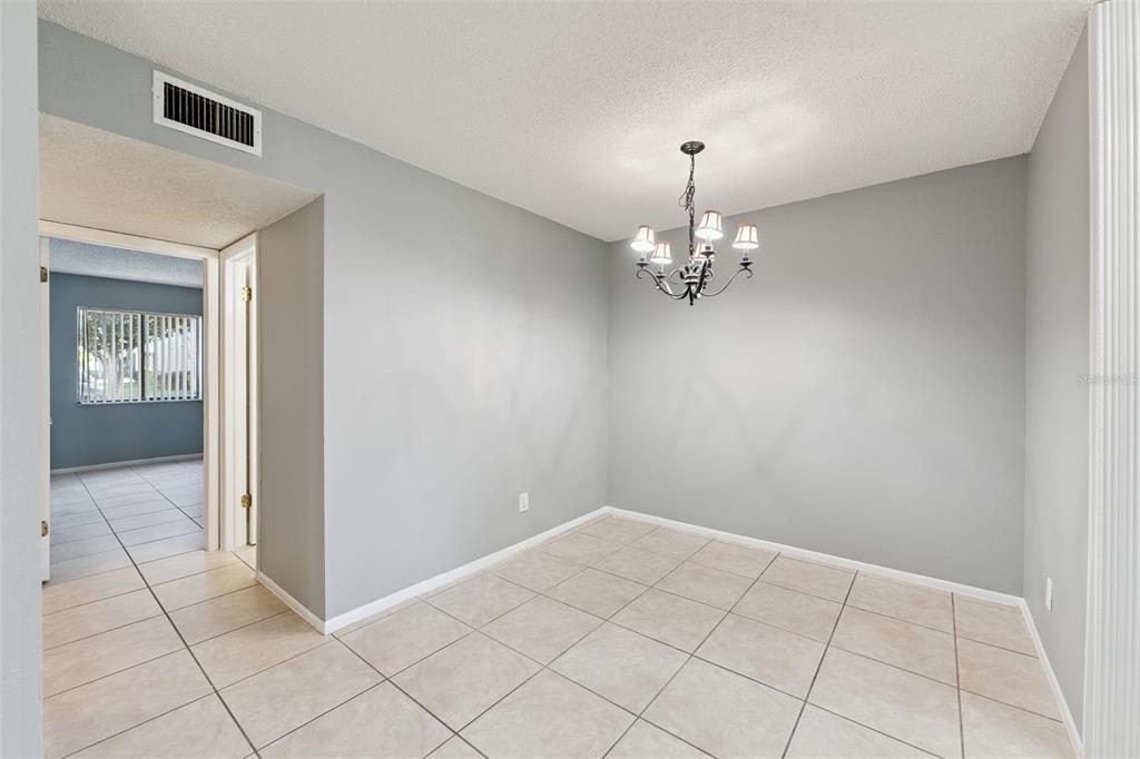 116 Springwood Circle, Unit A Longwood, FL 32750 - Photo 5 of 17 a view of an empty room with window
