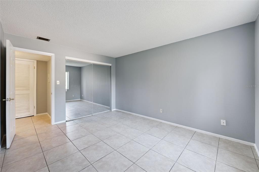 116 Springwood Circle, Unit A Longwood, FL 32750 - Photo 9 of 17 a view of an empty room and window