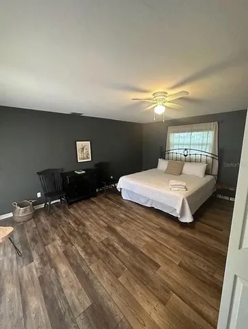 a bedroom with a bed and window