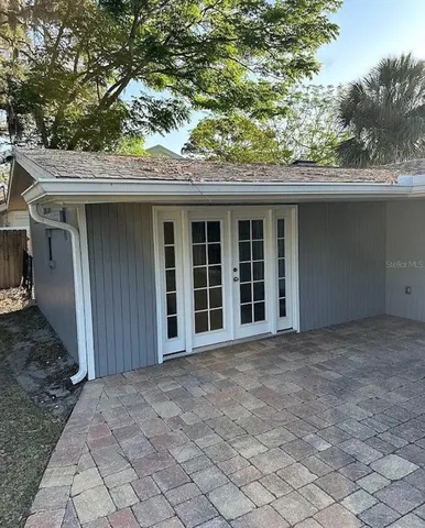 a view of a house with a tree
