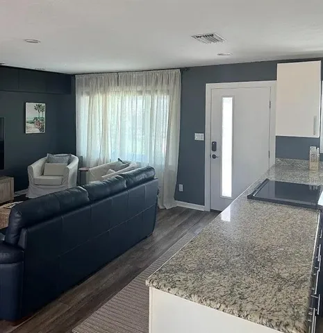 a living room with furniture and window