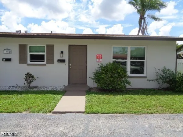 a front view of house with yard