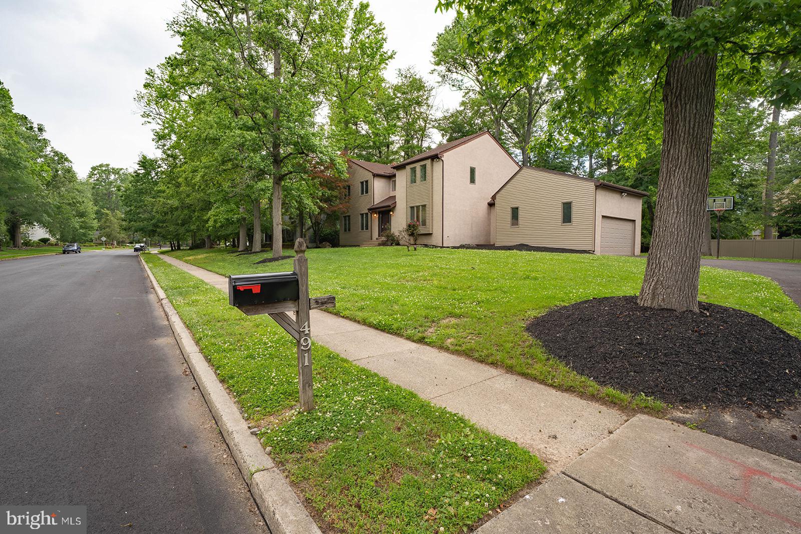 491 Kings Road Yardley, PA 19067 - Photo 3 of 52 a front view of a house with garden