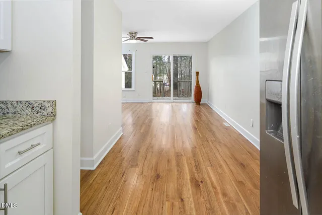 a view of an entryway with wooden floor