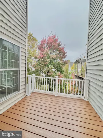 a view of hallway with wooden floor