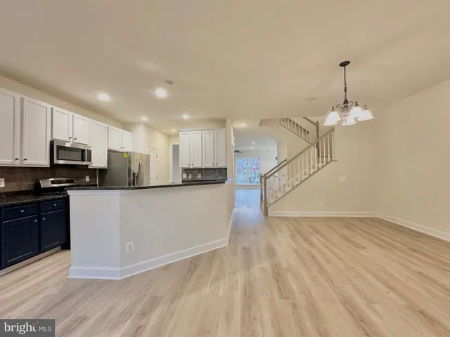 a view of room with window and hardwood floor