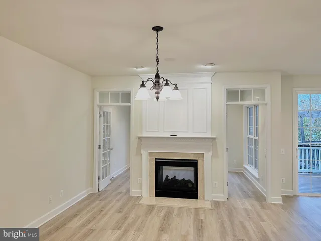 a white toilet sitting next to a white wall