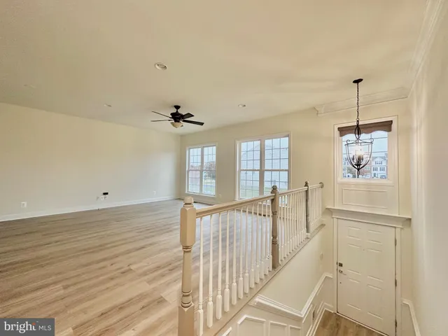 a bathroom with a white bath tub a toilet and a sink