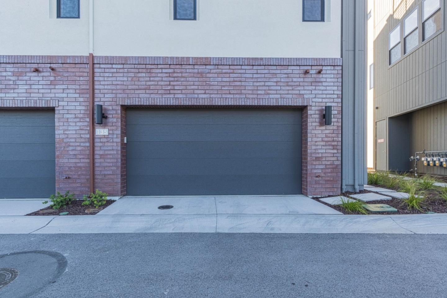 135 8th Street Marina, CA 93933 - Photo 21 of 69 a front view of a building with garage and yard