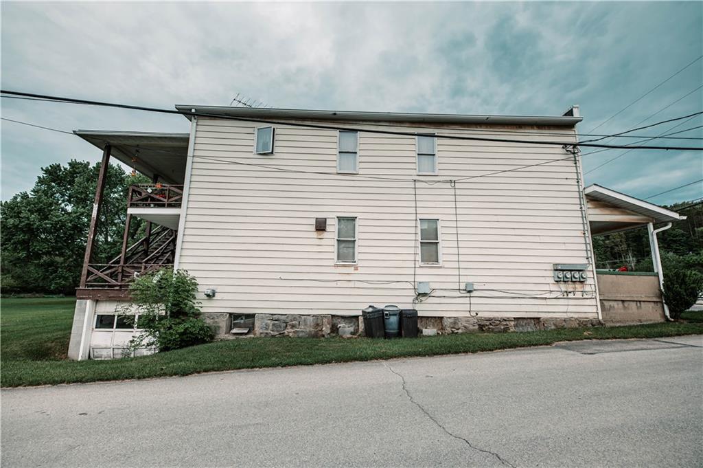 411 Indiana Road Creekside, PA 15732 - Photo 3 of 25 a front view of a house with a yard