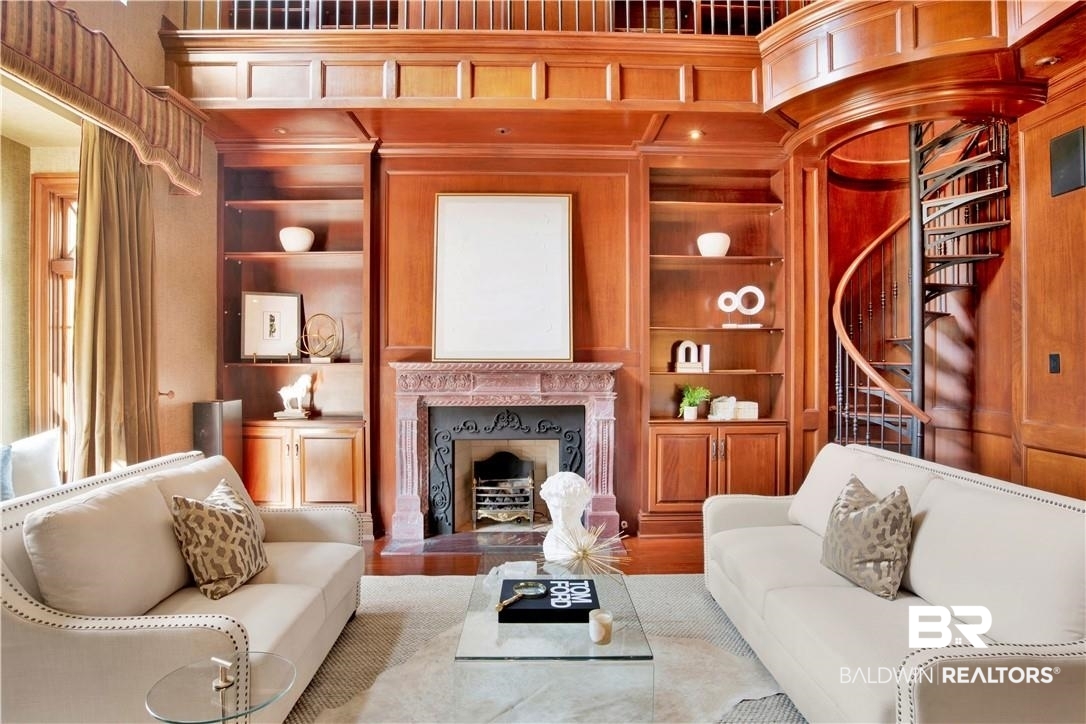 4 Chancery Court Mobile, AL 36608 - Photo 6 of 54 Living room with a high end fireplace, built in features, and hardwood / wood-style flooring