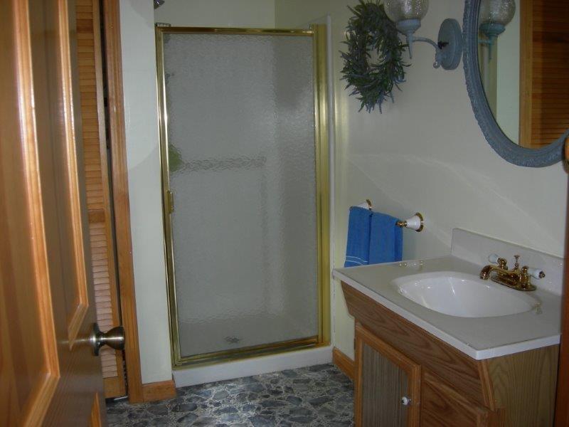 191 Goods Point Road Steuben, ME 04680 - Photo 10 of 15 Full bathroom with washer behind the...