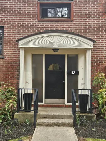 a view of a house with a bench