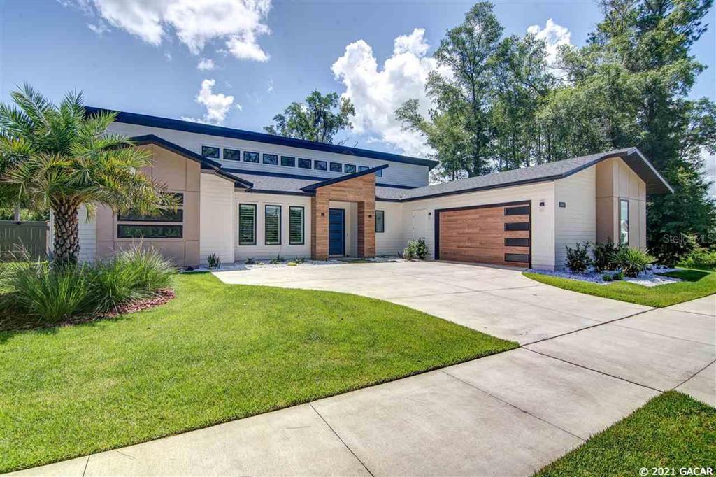861 Southwest 120th Drive Gainesville, FL 32607 - Photo 1 of 1 a view of a house with a yard