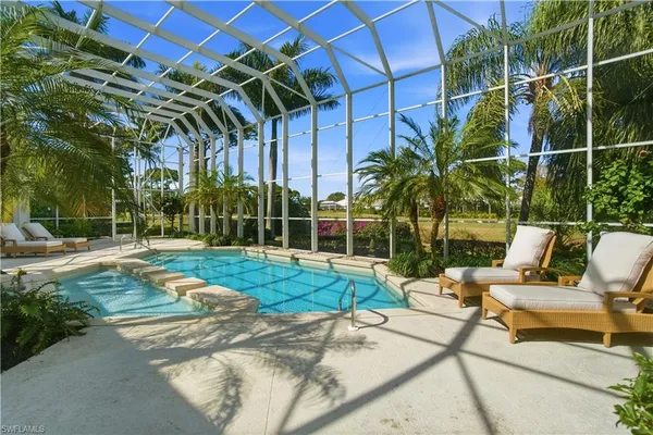 a view of a backyard with swimming pool