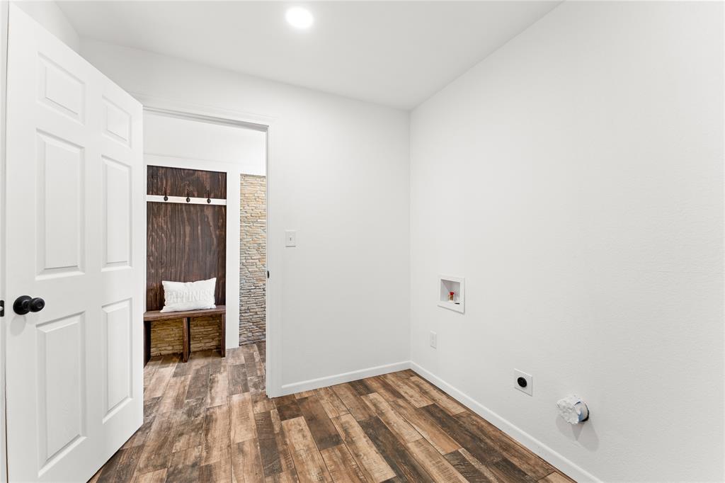 1265 North Houston Street Lorena, TX 76655 - Photo 22 of 29 a view of a room with wooden floor and a bathroom