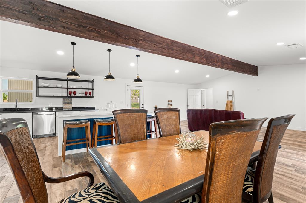 1265 North Houston Street Lorena, TX 76655 - Photo 6 of 29 a large kitchen with a table and chairs