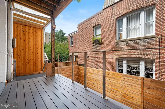 a view of a balcony with wooden floor