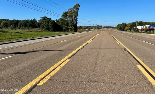 a view of a city street from a balcony