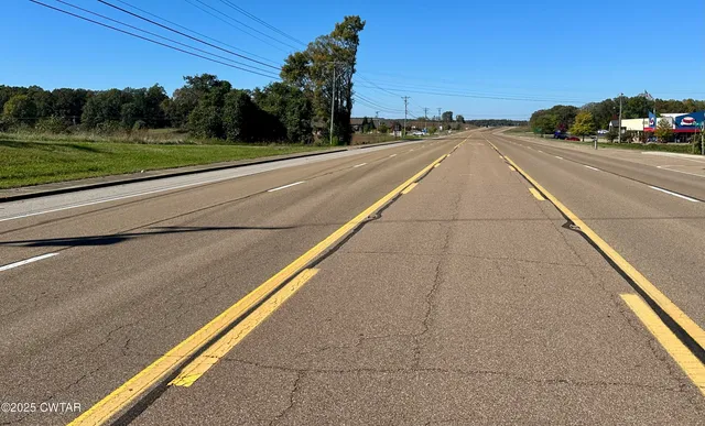 a view of a city street from a balcony