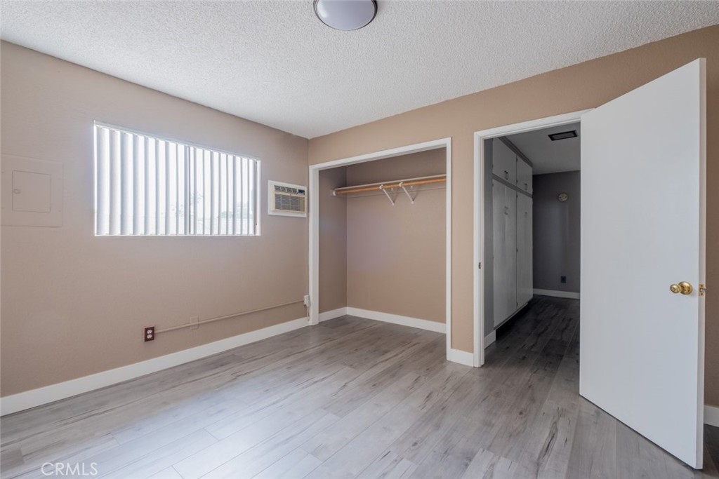 1341 North Keystone Street, Unit E Burbank, CA 91506 - Photo 16 of 16 a view of an empty room with wooden floor and a window