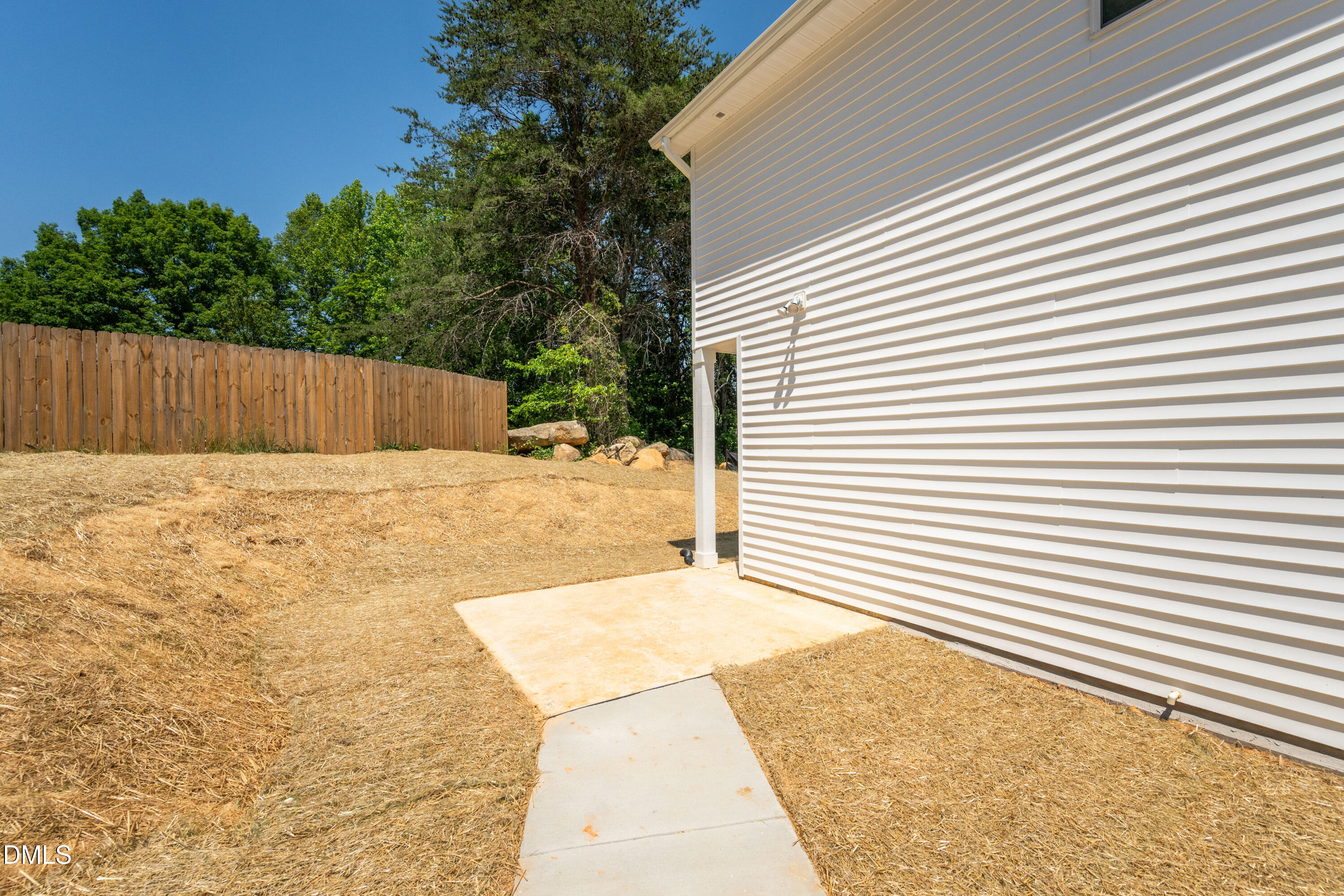 1182 Hurdle Mills Road Roxboro, NC 27573 - Photo 38 of 45 a view of backyard with a small cabin