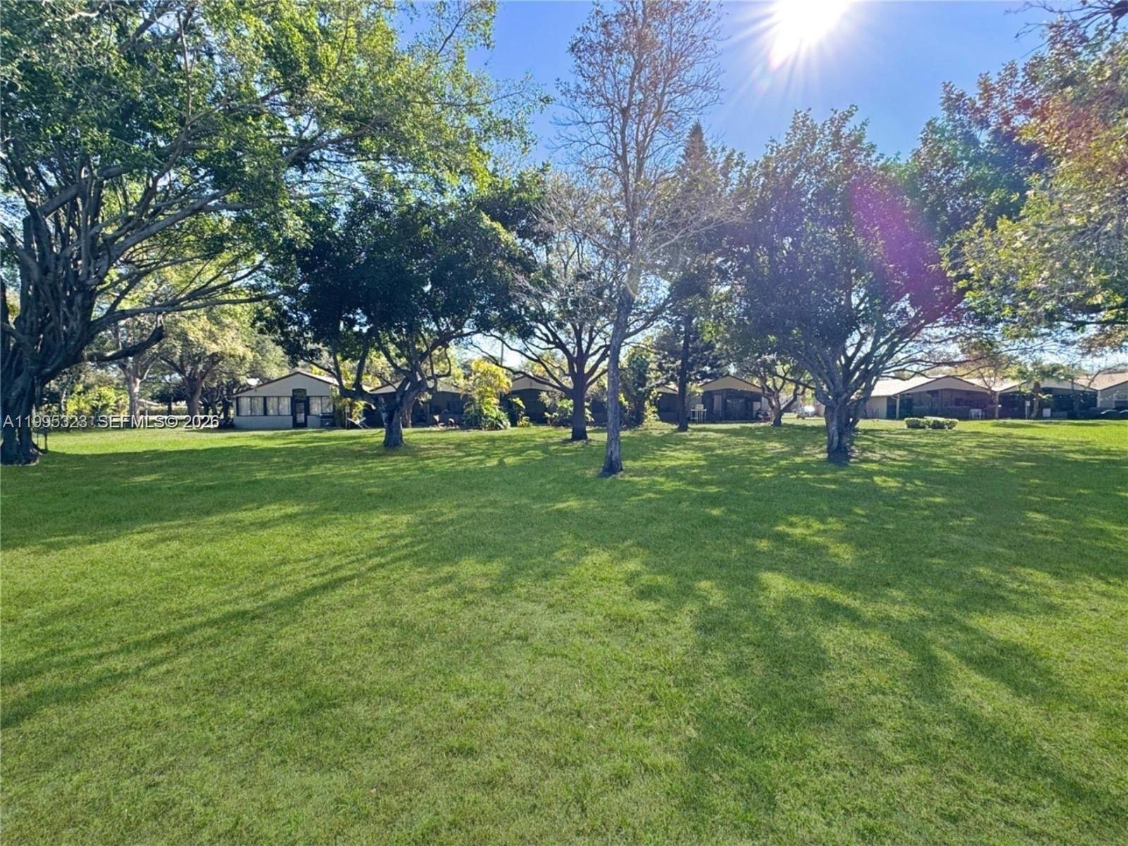 22278 Misty Woods Way, Unit 22278 Boca Raton, FL 33428 - Photo 15 of 20 a view of a green field