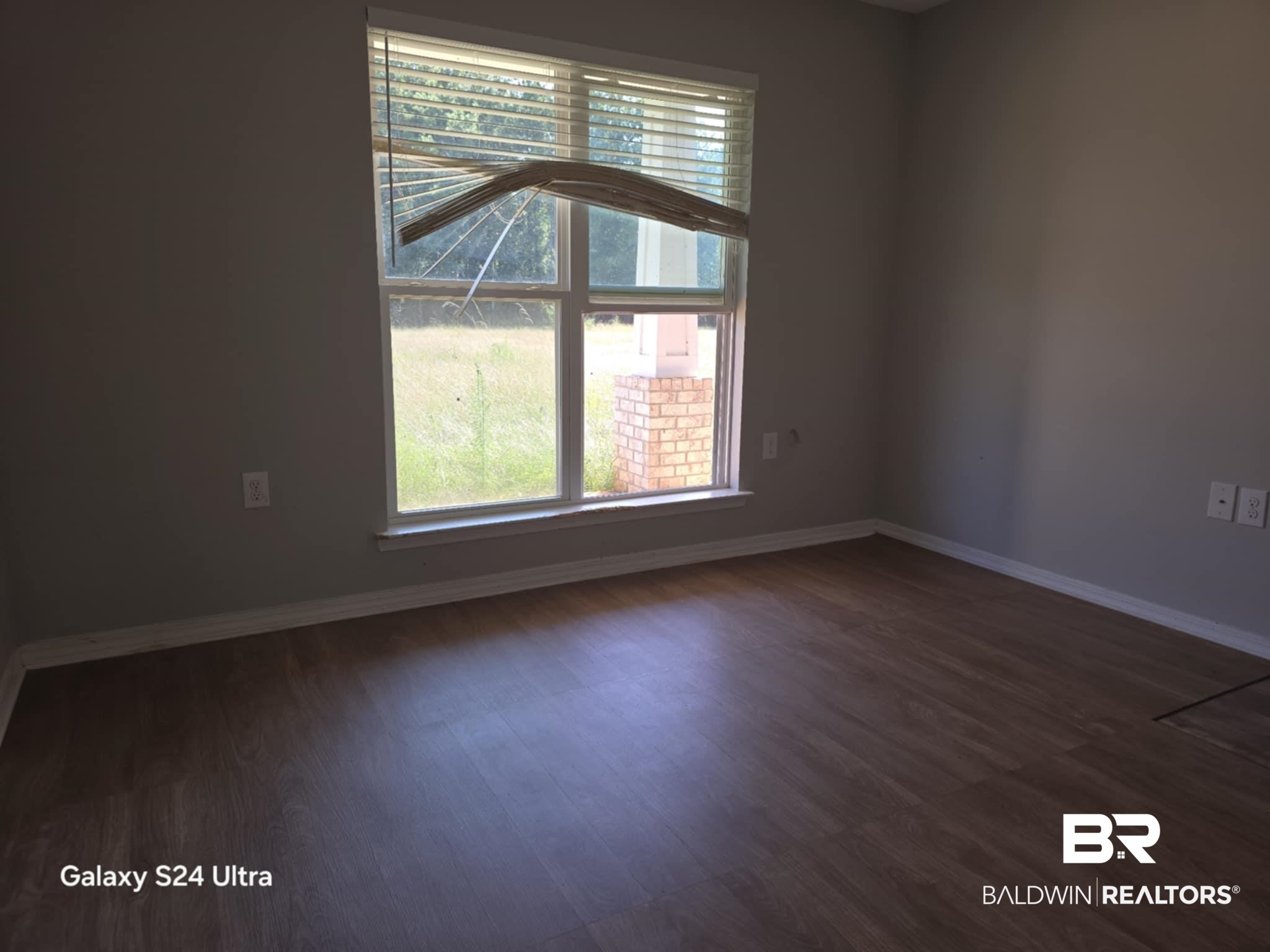 546 Wolf Log Road Flomaton, AL 36441 - Photo 13 of 15 Spare room with dark hardwood / wood-style flooring