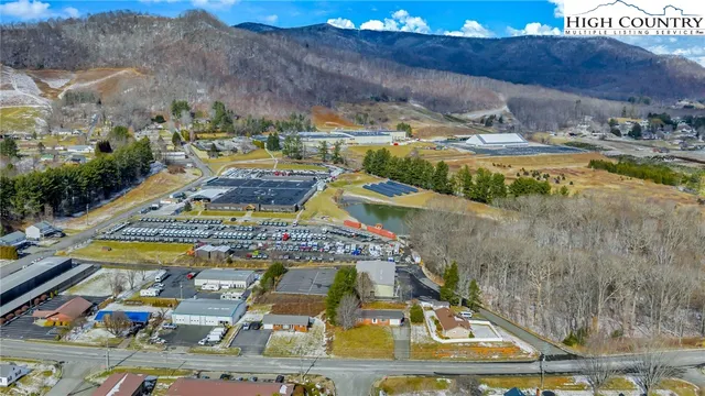 a view of walk in closet with wooden floor
