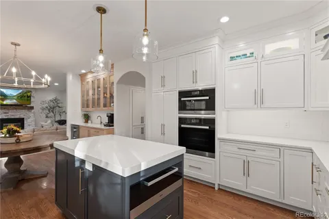 a kitchen with stainless steel appliances granite countertop a stove and a sink