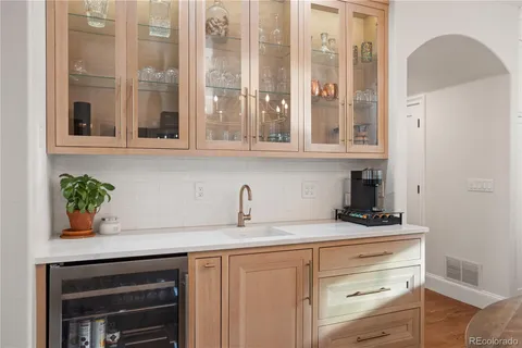 a living room with furniture and large windows
