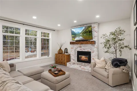 a dining room with wooden floor and a window