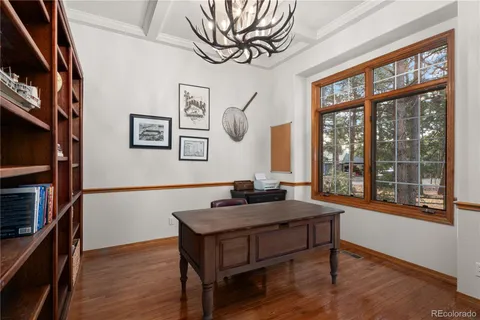 a spacious bedroom with a bed and a window