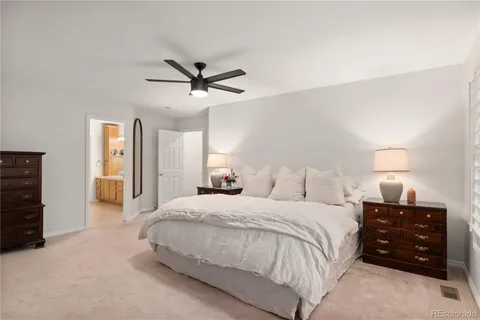 a bedroom with a bed and a fireplace