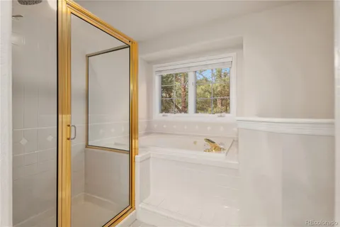 a bathroom with a double vanity sink mirror and double